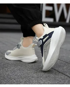 Lightweight and breathable children's running shoes in beige navy and grey colorway