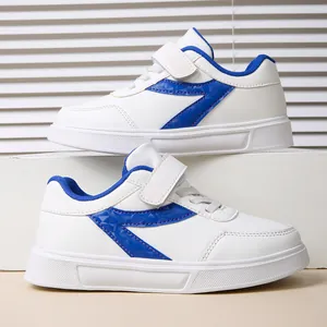 Side profile view of white girls' sneakers featuring blue lightning patterns for school wear.