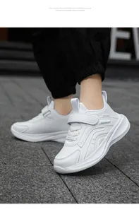 White breathable children's running sneakers with velcro straps and lightweight EVA soles