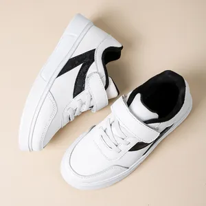 Casual white school sneakers for girls with hook-and-loop straps and black accents