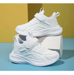 Side view of white children's breathable sneakers with Velcro straps for school
