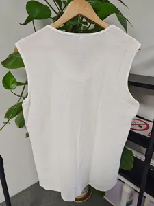 Back view of a white textured breathable sleeveless gym vest for men summer casual