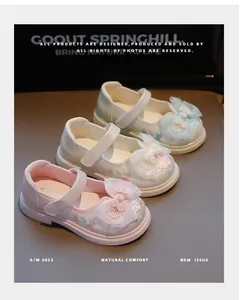 Detailed view of Chinese style embroidered Hanfu shoes for girls featuring large mesh bows