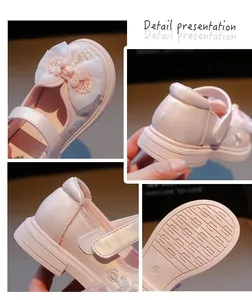 Close-up details of pink Hanfu-style girl's embroidered shoe with bow and floral patterns