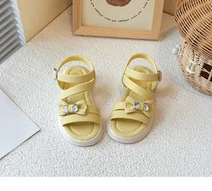 Yellow girls' princess sandals featuring an elegant bowknot and sparkling rhinestones