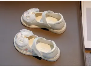 Elegant white embroidered Mary Jane shoes for girls with Chinese Hanfu style bow detail.