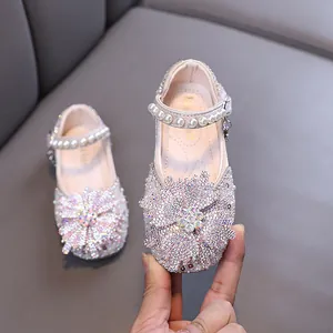 Elegant girls princess rhinestone flats featuring a pearl strap for dance and party wear