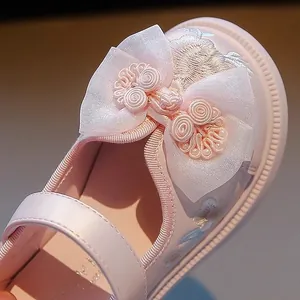 Pink traditional Chinese embroidered Hanfu shoes for girls with elegant bow detail.