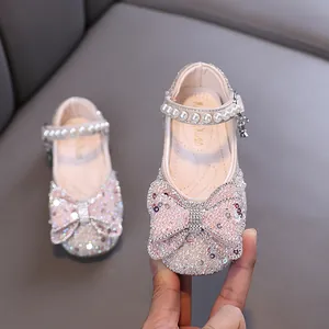 Elegant pink glittery princess shoes for girls decorated with rhinestones and pearls
