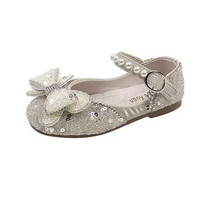 Sparkling girls' princess shoes with rhinestones, sequins, and a large bow