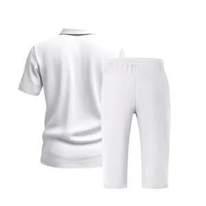 Back view of men's white linen summer set with short sleeve polo and cropped pants.