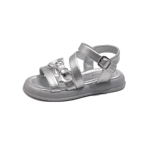 Stylish silver princess sandals for girls featuring a bowknot and sparkly rhinestones