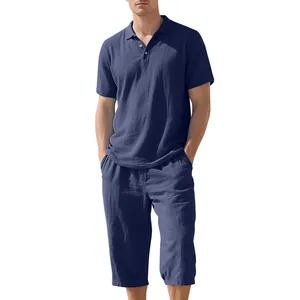 Detailed view of men's navy blue summer linen polo shirt and cropped pants set