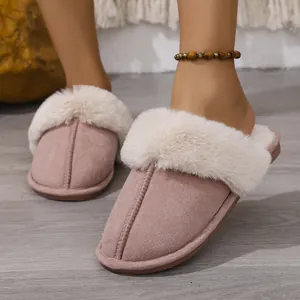 Close-up of pink fuzzy slippers featuring soft faux fur trim and cozy indoor comfort