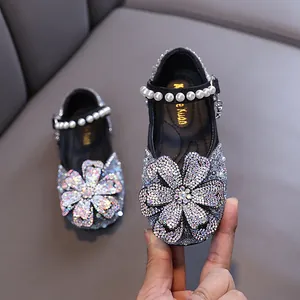 Sparkly rhinestone princess shoes for girls with elegant pearl strap and flower detail
