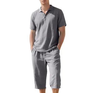 Men's two-piece gray linen summer set with polo shirt and cropped pants shown on model
