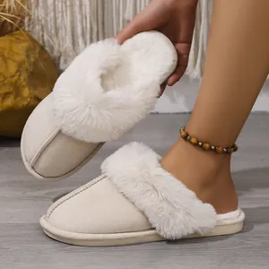 Close-up of cozy cream plush slippers with soft faux fur lining for indoor warmth.