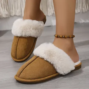 Close-up view of comfortable brown faux fur house slippers with soft warming lining