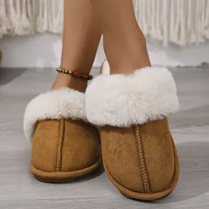 Close-up of cozy brown suede slippers with white faux fur lining and soft soles