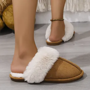 Detail view of cozy tan suede house slippers with plush white faux fur lining for winter