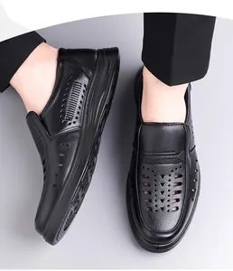 Close-up detail showing the breathable hollow pattern on men's black leather sandals