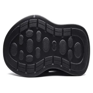 Detailed macro view of the black anti-slip rubber sole pattern on men's leather sandals