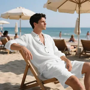 Relaxed fit white linen shirt and shorts set for men displayed at a sunny beach setting