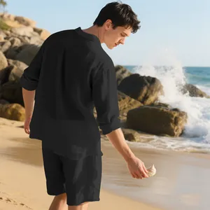 Black linen men's beach set shown in a relaxed outdoor seaside setting