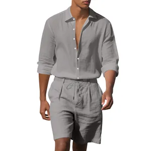 Detail of men's grey linen long-sleeve shirt and matching casual beach shorts set.