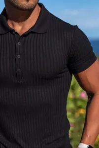 Close-up of men's athletic slim fit black ribbed polo shirt showing fabric texture