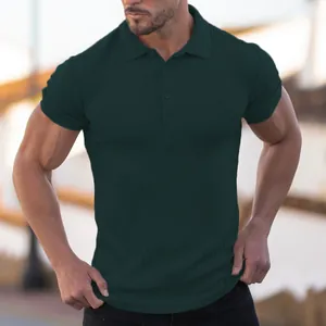 Close-up detail of a dark green ribbed muscle fit polo shirt for men on a model.