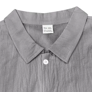 Close-up of men's linen shirt collar showing XXL size tag and fabric texture