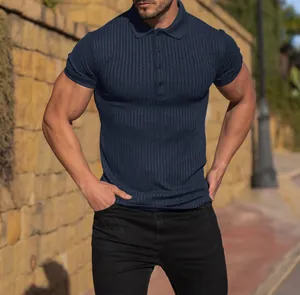 Close-up of navy blue ribbed muscle fit polo shirt featuring a classic button placket detail