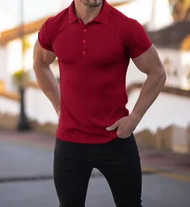 Close-up of muscular man wearing red ribbed short sleeve polo shirt for fitness.