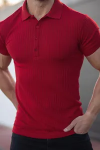 Close-up of a men's slim fit ribbed short sleeve polo shirt in red on model
