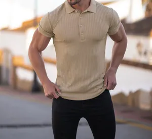 Close-up detail of a khaki ribbed muscle fit short sleeve polo shirt for men outdoors