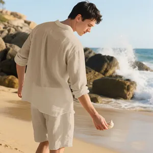 Detailed macro view of men's beige linen beach set showing textured fabric on a sunny beach