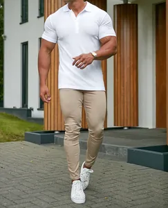 Muscular fit white ribbed polo shirt with beige slim trousers for men's casual outdoor wear
