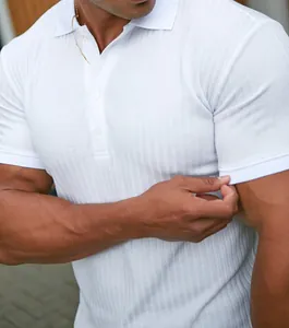 Close-up of white ribbed short sleeve polo shirt on athletic male model