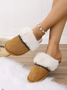 Cozy women's brown fuzzy slippers with white fur trim and decorative band details