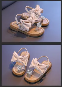 Elegant girls' sandals with oversized bow and rhinestone flower decoration