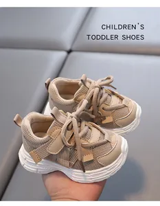 Close-up of breathable mesh toddler sneakers with durable anti-slip white soles.