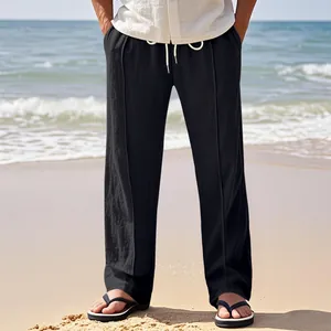 Detail showing the breathable linen texture and loose fit of black men's beach trousers