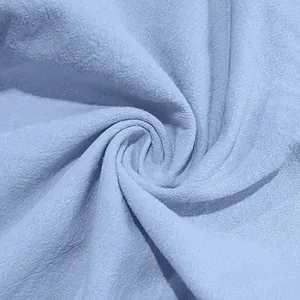 Detail view showing the soft texture of light blue breathable linen fabric for men's summer beach set