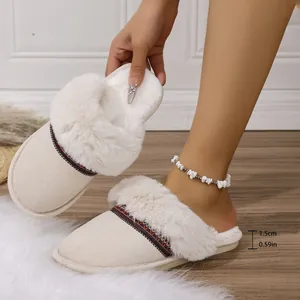 Detailed view of women's warm plush slippers with 1.5cm thick sole parameter and ethnic band
