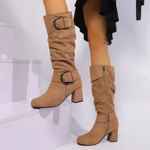 Stylish tan suede mid-calf boots for women with buckle straps and chunky high heels