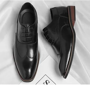 Classic black men's Oxford business shoes on elegant white fabric