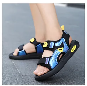 Detail view of blue and black boys' non-slip sports sandals with soft rubber soles.