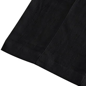 Close-up detail of black breathable linen fabric and seam for men's casual trousers