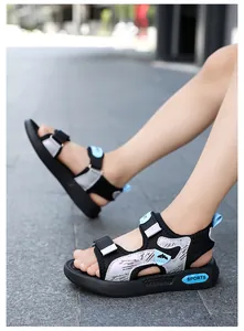 Detailed side view of boys' non-slip sports sandals worn outdoors